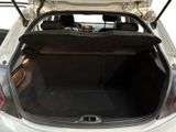the back of a car with its trunk open and the seat folded down