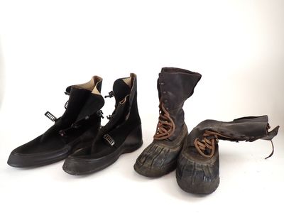 three pairs of shoes that are lined up on a white surface