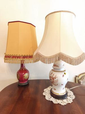 a table with a lamp and a lamp shade on it