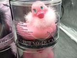 three tubs of bath bombs with a pink duck in them