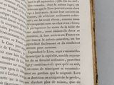 a book open on a table with a picture on it