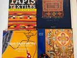three books are sitting on a table next to each other