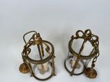 pair of brass and glass candle holders with shells and seashells