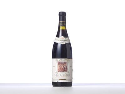 a close up of a bottle of wine on a table