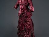 a red dress with a ruffled skirt on a mannequin mannequin mannequin mannequin mannequin mannequin mannequin mann