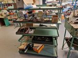 many different types of tools on the shelves in the shop