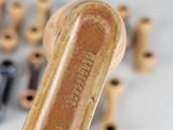 a close up of a baseball bat with a lot of other items in the background