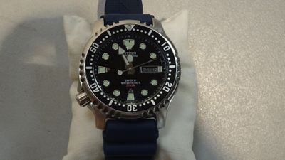 a watch that is sitting on top of a napkin