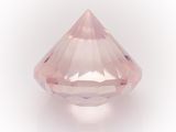 a close up of a pink diamond on a white background