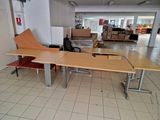 a desk with a chair in the middle of the room