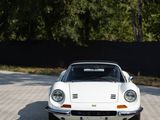 a white car that is parked on the side of the road