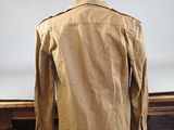 the back of a tan jacket on a mannequin mannequin mannequin mannequin mannequin mannequin mannequin mannequin