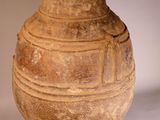 a large vase that is sitting on a white surface