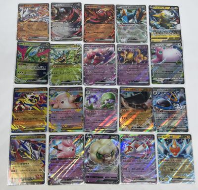 a bunch of pokemon cards sitting on top of a table