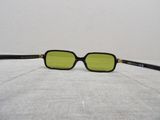 a close up of a pair of glasses on a bed