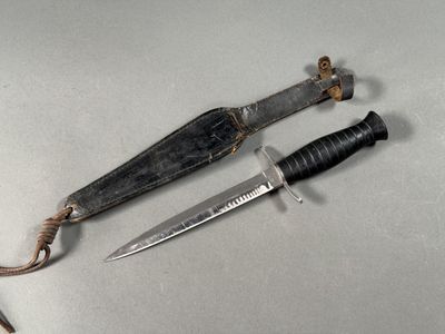 two knives that are laying on a table