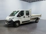 a white truck that is parked in a room