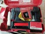 a red tool box with tools in it on a tiled floor
