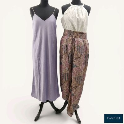 two women ' s dresses on mannequins on display against a white background