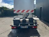a truck that is parked in front of a building