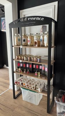 a display of jars and jars on a shelf in a store
