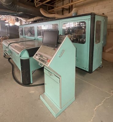 two machines that are sitting in a building