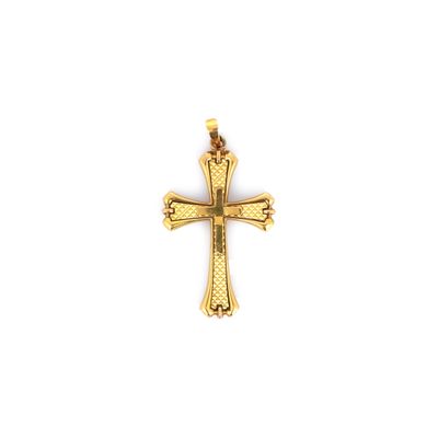 pendentif en forme de croix en or sur fond blanc