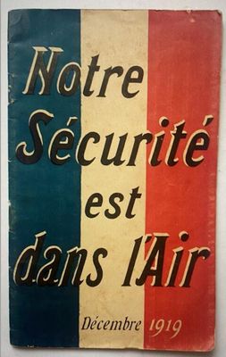 a close up of a book on a table with a red, white and blue cover