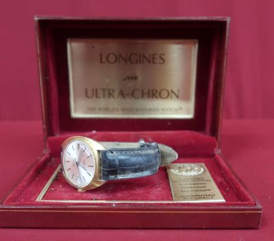 a watch in a box with a plaque on it