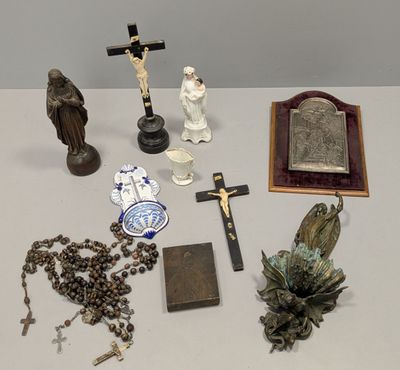a lot of religious items on a white table