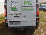 a white van that is parked in the grass
