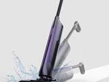 a person is using a vacuum cleaner to clean the floor