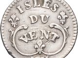 a close up of a silver coin with a lizard on it