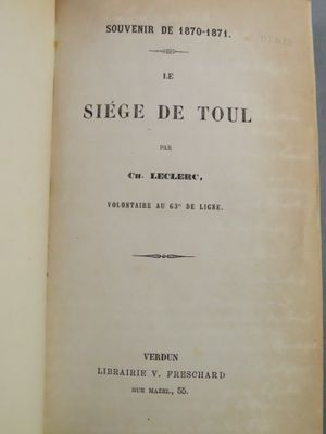 an open book with a black and white image of the title on it