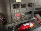 a car dashboard with a fire extinguisor in it