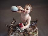 a figurine of a boy brushing his teeth with a toothbrush