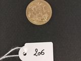 a close up of a coin with a price tag on it