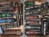 two boxes full of different types of toy trains
