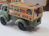 a toy truck with a box on the back of it