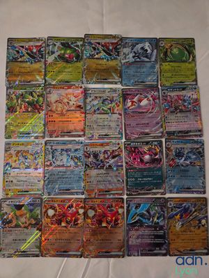 a bunch of pokemon cards sitting on top of a table