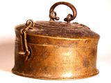 a small metal box with a handle on it