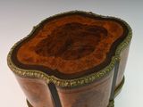 a small wooden box with a decorative design on it