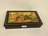 an image of a box with a painting on it sitting on a table