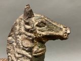 a statue of a horse that is sitting on a table