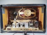 a clock in a box with wires and wires attached to it