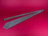 a close up of a tie on a red background