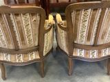 two chairs sitting next to each other in a room