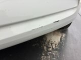 a white car that has a lot of dirt on the side of it