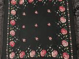a black scarf with pink roses and leaves on it