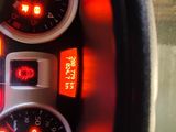 a close up of a car dashboard with various gauges and numbers